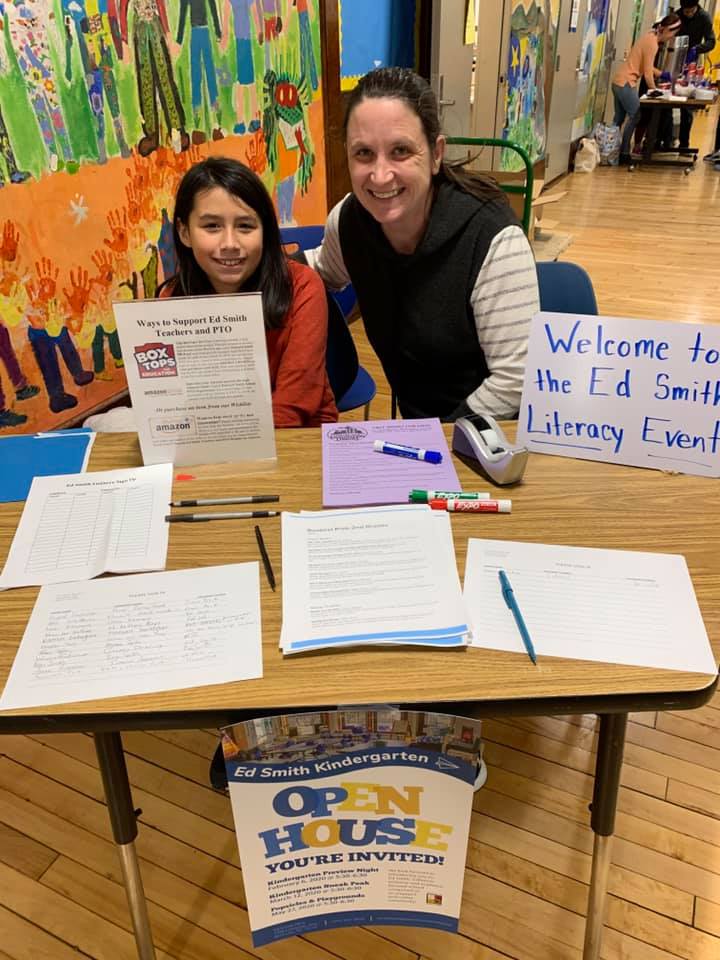 Parent and student volunteering at literacy night