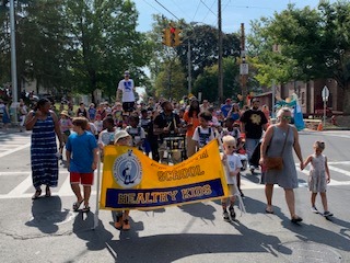 Ed Smith students, teachers, and families in the Westcott Cultural Fair parade